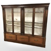 A Victorian mahogany glazed four door bookcase,