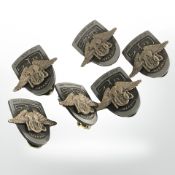 A group of Harley Owners Group diecast metal lapel pins.