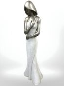 A contemporary silvered composition figure of a lady, height 139 cm.