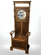 An Arts and Crafts oak storage hall stand, 79 cm x 37 cm x 185 cm.