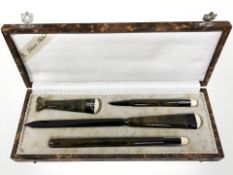 An Art Deco four piece stationery set, including desk seal, propelling pencil, letter knife, etc,