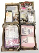 A large quantity of card crafting supplies.