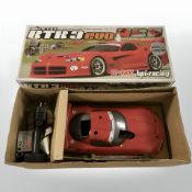 An RTR3 Evo 1:10 scale four wheel drive remote control car, in box.