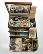 A tray of contemporary jewellery boxes and their contents comprising costume pendants, necklaces,