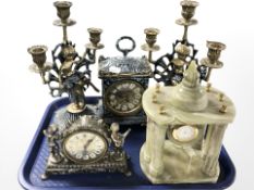 A decorative brass battery operated clock garniture set,
