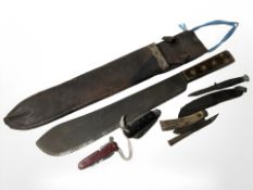 A 20th century military issue machete, in leather sheath, together with Swiss army knife,