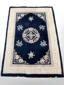 A Chinese rug on indigo ground,