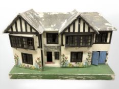 An early 20th century Tri-ang doll's house,