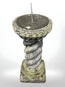 A concrete garden sun dial,