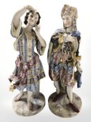 A pair of continental bisque porcelain figures of lady and gentleman in Eastern attire,