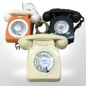 Three vintage plastic telephones