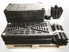 A quantity of plastic shelving (dismantled)