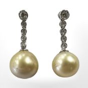 A pair of 14ct white gold Tahitian pearl and diamond drop earrings, the total diamond weight 0.