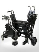 A Lomax folding wheel chair,