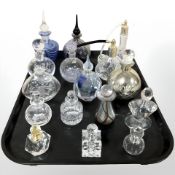 A group of glass perfume bottles and atomisers, including Isle of Wight Alum Bay lustrous example,
