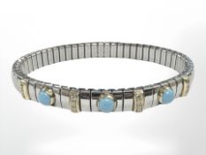 An Italian Nomination stainless steel expanding bracelet with gold mounts and turquoise cabochons
