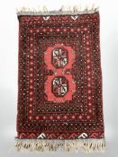 A Turkoman rug, Afghanistan, 81 cm x 47 cm, together with a further machine made mat.