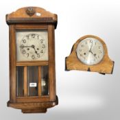 An early 20th century continental wall clock with silvered dial and an art deco mantel clock