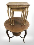 An Edwardian walnut shaped top occasional table and a walnut nest of three tables, width 50 cm.