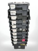 Ten plastic stackable storage boxes with folding lids,