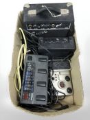 A Fender Squier amplifier, miniature amplifier, Zoom Player 2100 effects pedal,