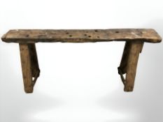 A 19th century rustic elm bench on A-frame supports,