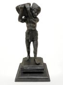 A contemporary oriental bronze statue on wooden plinth of a man carrying a basket, height 18.5 cm.