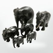 A group of African carved ebony elephants, tallest 18 cm.