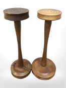 Two turned wooden stands, height 55 cm.