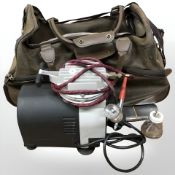 A holdall containing Premi-Air air brush.