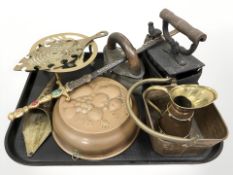Antique metal wares including copper jelly mould, brass trivets, two irons,