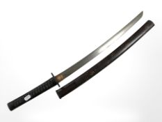 A reproduction Japanese short sword (or Wakizashi) in lacquered wood scabbard,
