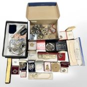Two shoe boxes of mixed costume jewellery, simulated pearls, brooches,