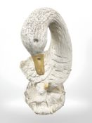 A concrete garden swan ornament,