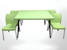 An Isildar Siesta plastic garden table and set of four chairs, table 125 cm x 106 cm x 79 cm.