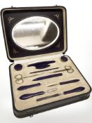 An Art Deco Bakelite mounted manicure set, in fitted box.