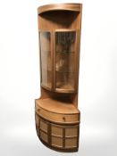 A nathan teak bow front corner cabinet, height 194 cm.