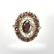 A 9ct gold garnet cluster ring, size L CONDITION REPORT: 3.