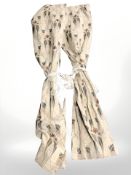 A pair of floral curtains.