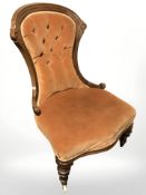 A Victorian walnut lady's salon chair.