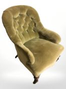 A Victorian mahogany armchair in olive velvet upholstery
