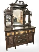 An Art Nouveau walnut mirror backed sideboard,