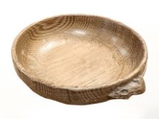 A Robert 'Mouseman' Thompson of Kilburn adzed oak nut bowl, with carved mouse signature,