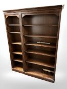 A reproduction two-part open bookcase, with adjustable shelves, overall 153 cm x 40 cm x 202 cm.