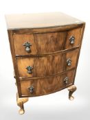 A burr walnut bow front three drawer chest, width 48 cm.