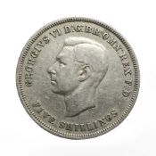 A 1951 George VI crown.