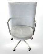 A Danish Erik Jorgensen designed Partner chrome framed executive swivel armchair in pale blue suede