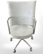 A Danish Erik Jorgensen designed Partner chrome framed executive swivel armchair in pale blue suede
