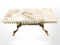 A gilt metal and onyx rectangular coffee table, length 97 cm.