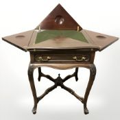 A Victorian mahogany envelope card table, 55 cm wide unextended.